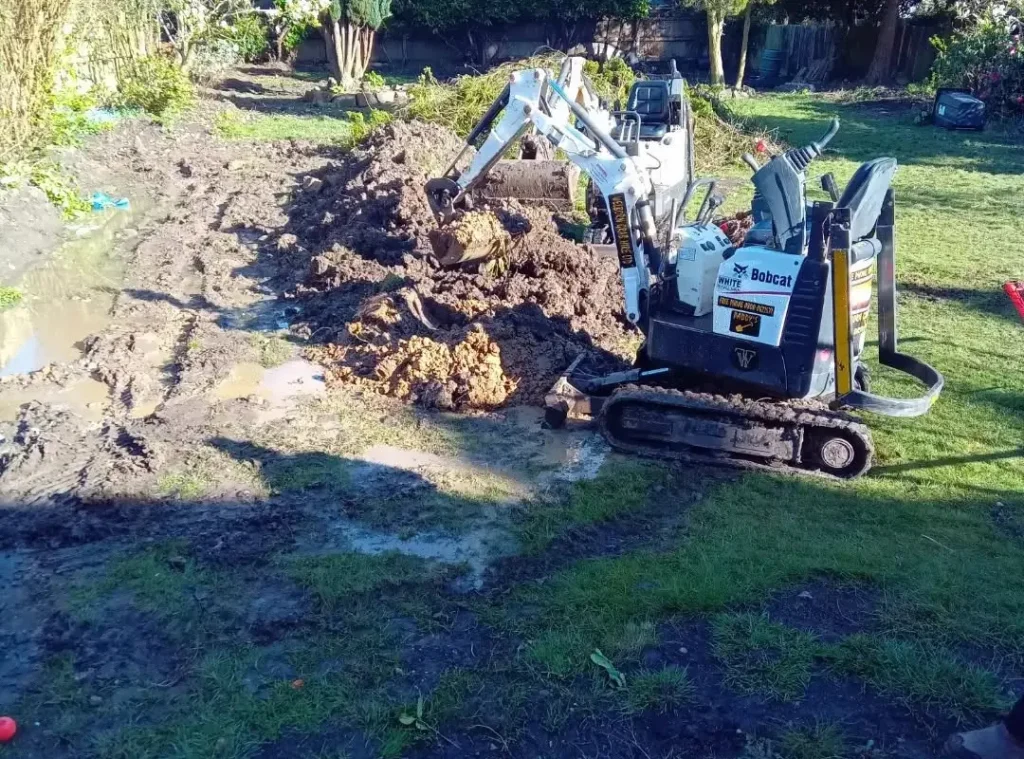 a construction vehicle digging a hole in the ground