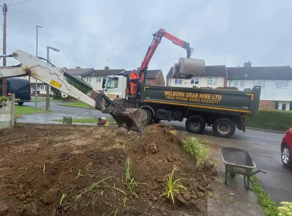 a construction vehicle with a bucket on the back of it