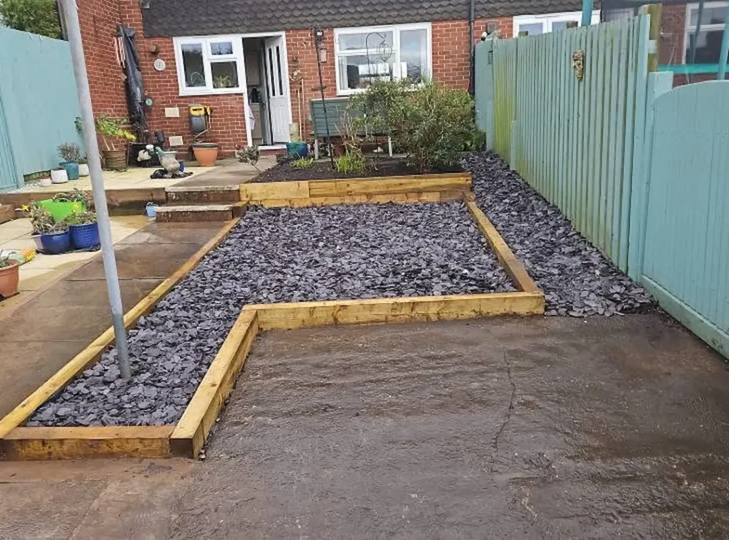 a garden with rocks in the ground